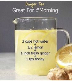 ginger tea in a mug with lemon and ginger on the side