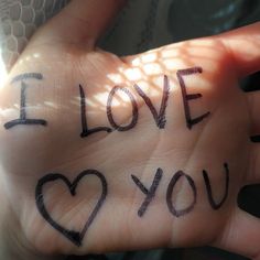 someone has written i love you on their palm