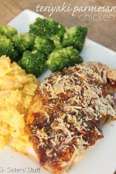 a white plate topped with chicken, rice and broccoli