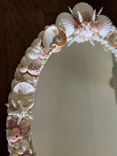 a mirror with seashells and shells on it