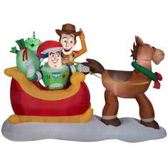 an inflatable toy with characters riding on a sleigh