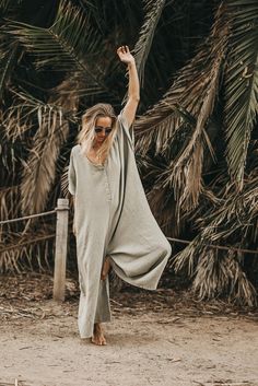 The Kaftan Jumpsuit // Sage – Beachwood Baby Casual Green Relaxed Fit Maxi Dress, Casual Solid Color Loungewear Maxi Dress, Casual Relaxed Fit Green Maxi Dress, Summer Jumpsuits And Rompers With Relaxed Fit, Casual Spring Jumpsuits And Rompers For Relaxation, Oversized Casual Summer Maxi Dress, Relaxed Summer Jumpsuits And Rompers For Lounging, Spring Flowy Loungewear Jumpsuits And Rompers, Spring Loungewear Jumpsuits And Rompers, Flowy Fit