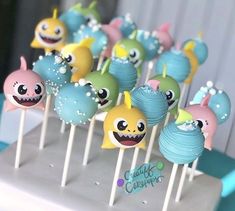 there are many cake pops with different designs on them