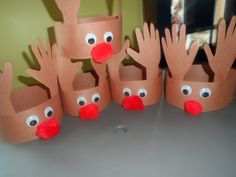 some paper cups that have been made to look like reindeers