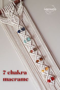 the white macrame is decorated with beads and other things to make it look like something