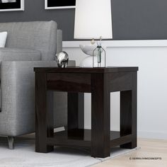 a living room scene with focus on the end table and sofa in the back ground