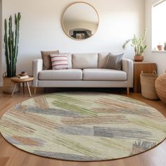 a living room with a couch, mirror and potted plants