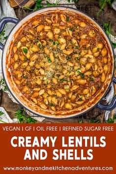 creamy lentils and shells in a large pot with text overlay