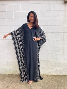 Indulge in the beauty of our classic kaftan with hand silk-screen printed fabric. This kaftan dress boasts unique patterns on high-quality rayon fabric. Its versatile design allows you to create many stylish looks, ensuring you always feel your best, whether you're at home or stepping out. Traditional Black Printed Kaftan, Silk Maxi-length Free Size Kaftan, Black Fitted Floor-length Kaftan, Luxury Black Long-sleeved Kaftan, Black Printed V-neck Kaftan, Screen Printed Fabric, Hang Loose, Stepping Out, Rayon Fabric