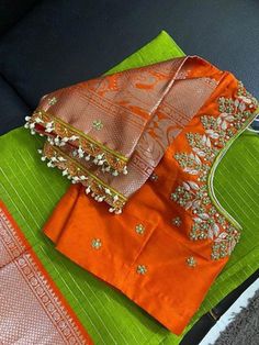 Looking For Fully Customized Blouse? Custom Measurements? Customized Designs? No Problem We Are Here To Help You Out With The Dream Attire You Are Looking For. We Have Well Experienced In-House Designers Who Can Make Your Dream Come True. We Design Fully Customized Handmade Maggam Blouse On The Colour And Design You Choose. You May Request For Any Further Modifications As Per Your Choice. A Minimal, Reasonable Charges Will Be Applied If There Are Any Major Differences.  Please Reach Us For Your Green Blouse For Wedding And Transitional Seasons, Transitional Green Blouse For Wedding, Wedding Green Blouse Piece With Motifs, Anarkali Top With Motifs For Wedding, Wedding Orange Choli With Motifs, Orange Wedding Choli With Motifs, Traditional Orange Blouse With Zari Work, Orange Self Design Blouse For Navratri, Orange Blouse With Pallu For Navratri