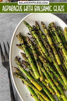 asparagus with balsamic glaze on a white plate