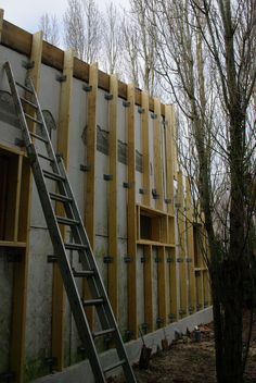 a ladder is next to a building under construction