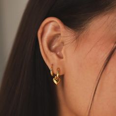 Slip into style with our Sleek Huggies earrings. These hoops are perfect for adding a touch of effortless sophistication to any outfit. Comfortable and chic, they are a must-have addition this spring. Material: Gold Vermeil Dimensions: 13.2mm x 14mm SKU: SAE-0200 Huggie Charm Earrings, Gold Hoop Earrings With Charms, Double Lobe Piercing, Quirky Accessories, Evry Jewels, Gold Huggie Earrings, Outfit Comfortable, Double Piercing, Earrings Double