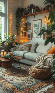 a living room filled with lots of furniture and plants on the wall above it's windows