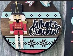 a sign that says what's crackin? with a nutcracker on it