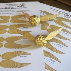 gold foiled chocolates are on top of white paper