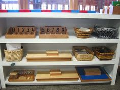 the shelves are filled with different types of wooden blocks and baskets on top of them