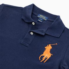 Introduce your child to timeless style with the Ralph Lauren Kid's Big Logo Short Sleeve Polo Shirt. Crafted with high-quality materials, this shirt features a bold logo and ensures comfort and durability. Perfect for any occasion, your child will stand out in this classic and stylish polo. Color: French Navy Style: 322565124003 Navy Short Sleeve Ralph Lauren Top, Navy Ralph Lauren Short Sleeve Tops, Ralph Lauren Navy Short Sleeve Tops, Blue Cotton Ralph Lauren Polo Shirt, Navy Ralph Lauren Cotton Tops, Navy Style, Bold Logo, Ralph Lauren Kids, French Navy