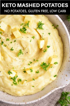 a white bowl filled with mashed potatoes and parsley