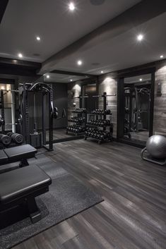 an empty gym with rows of exercise equipment