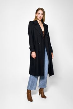 Step out in style with the Audrey Trench Coat by Lakeyo – the ultimate in sleek, sophisticated fashion.Crafted from a premium blend of 97% polyester and 3% spandex, this trench coat offers both style and comfort. The lightweight material makes it perfect for layering, while the tailored fit flatters your figure with a belted waist to accentuate your curves.Featuring a classic double-breasted front closure and a notched collar, the Audrey Trench Coat has a timeless, versatile look that never goes out of style. The premium material is both lightweight and durable, making it the perfect choice for any occasion.The Audrey Trench Coat by Lakeyo is available in a range of sizes, ensuring a perfect fit for any body type. Whether you're dressing up for a special event or simply running errands aro Sophisticated Fashion, Wool Winter Coat, Winter Pants, Trench Coat Black, Winter Tops, Winter Essentials, Notched Collar, Sophisticated Style, Wool Coat