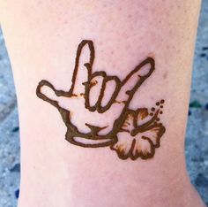 a person with a tattoo on their foot that has a peace sign drawn on it