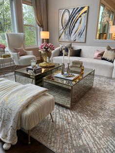 a living room with two couches and a coffee table in front of a window