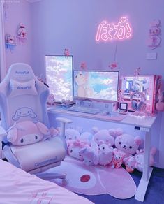 a room with two computer monitors and stuffed animals