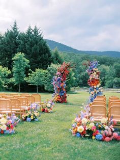 an outdoor ceremony set up with chairs and flowers