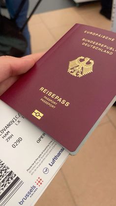 a person holding a passport in their hand