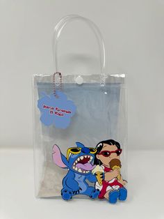 Disney Style Gift Bag, Rectangular Shape, Blue Disney Bags For Gifts, Themed Blue Bags For Gifts, Themed Rectangular Bag For Gifts, Themed Rectangular Gift Bag, Themed Rectangular Bag As A Gift, Blue Novelty Bags For Gifts, Novelty Blue Bags For Gifts, Cute Rectangular Bags For Birthday Gift