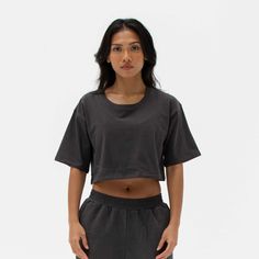 The Easy Crop Top is a must-have essential in your wardrobe. You will love our lightweight organic cotton crop top, which is perfect for your everyday basics. This piece is such a staple throw on our matching comfy sweats for a flawless street look or pair it with your favourite leggings or jeans. Ideal for in the gym and out on the streets. Made from our lightweight organic cotton. 95% organic cotton, 5% Elastane. Dyed with certified Eco-Friendly dyes. GOTS & OEKO-TEX® approved. All packaging is recycled or responsibly sourced. Casual Cotton Crop Top For Workout, Cotton Athleisure Cropped T-shirt For Workout, Cotton Cropped T-shirt For Loungewear, Casual Cotton Crop Top Activewear, Effortless Black Cotton Top, Boxy Fit Cotton Cropped Shirt For Everyday, Boxy Cotton Cropped Shirt For Everyday, Everyday Basic Cotton Crop Top, Basic Everyday Cotton Crop Top