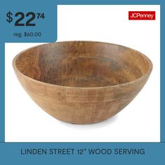 a wooden serving bowl is on sale for $ 22