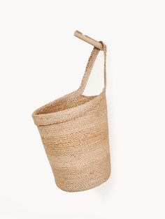 Korissa Kata Wall Hanging Basket Korissa Handwoven Eco-friendly Bucket Straw Bag, Eco-friendly Beige Handwoven Bucket Bag, Eco-friendly Handwoven Bucket Bag, Eco-friendly Basket-shaped Natural Fiber Bucket Bag, Handwoven Basket-shaped Bucket Bag For Market, Wall Hanging Basket, Natural Home Decor, Hanging Baskets, Fair Trade