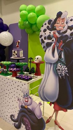 the table is decorated with balloons and decorations for halloween time, as well as an animated character