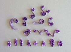 the letters are made out of purple paper