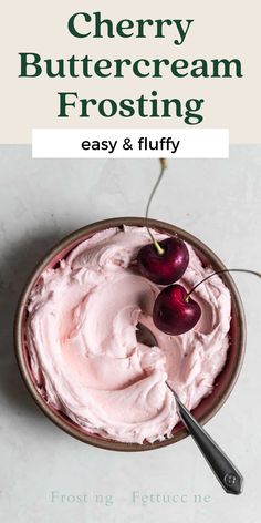 a bowl filled with whipped cream and two cherries on top of it, text reads cherry buttercream frosting easy & fluffy