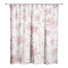 a pink and white shower curtain with flowers on it