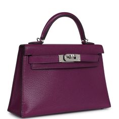 This Kelly, in the Sellier style, is in Anemone chevre leather with palladium hardware, has tonal stitching, two front straps with front toggle closure, single rolled handle and a removable shoulder strap.The interior is lined with Anemone lambskin leather and has one open pocket on the back wall.Collection: YOrigin: FranceCondition: Pre-owned; Mint - This bag retains its shape structure. The exterior leather is clean with no signs of wear or use. There is plastic on hardware except on the turnlock and one of the hardware feet. There are light but visible hairline scratches to the exposed hardware. The interior is clean with no signs of wear.Accompanied by: Hermes box, Hermes dustbag, shoulder strap, shoulder strap dustbag, feltMeasurements: 7.5" width x 4.5" height x 2.2" depth; 2.5" hand Formal Togo Leather Bags, Hermes Kelly Sellier, Kelly Sellier, Hermes Box, Madison Avenue, Anemone, Lambskin Leather, Dust Bag, Shoulder Strap