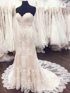 a wedding dress on display in a store