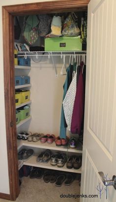 an open closet with shoes and other items