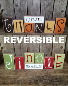 the words give thanks, thanks and thanks are spelled in wood blocks on top of a wooden