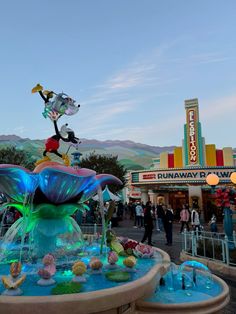 the fountain is decorated with colorful decorations and lights