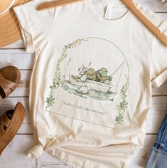 Vintage Cottage Core Book Lovers Frog and Toad Gift for Her Readers Gift Graphic Tee Gift for Friend Teahers Gift Classic Readers Gift Tee Stay Nice and Comfy, this tee shirt is perfect for wearing all day, customers love this classic unisex jersey short sleeve tee which fits like a well-loved favorite. Soft cotton and quality print makes you want to wear it over and over again. About this Shirt: These t-shirts have-ribbed knit collars to bolster shaping. The shoulders have taping for better fit Cottage Core Vintage, Frog Gifts, Frog And Toad, Gifts For Readers, Gift For Friend, Toad, Vintage Book, Look Chic, Modest Outfits