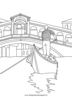 a man in a gondola on a canal with buildings and bridge behind him