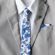 Let your look shine with floral skinny neck ties with matching pocket square. Our floral neck tie line offers a huge selection of flower and floral patterned ties come in various stylish colors. Harper collections includes adult skinny necktie, adult and child matching bow ties and pocket square. www.tie-mood.com Color:  Blue and White Floral Imported and Handmade Material:  100% Cotton Adult Necktie Dimensions:  Width: approx. 2.25 in/6 cm    Length:  approx. 56 in Adult Bow Tie (Pre-tied): 11.5 inches to 20 inches  Child Bow Tie (Pre-tied): 9 inches to 15.5 inches Pocket Square: 9 in x 9 in or 23 cm x 23 cm Wedding Ties For Men, Blue Floral Tie, Pocket Square Wedding, Tie Matching, Blue Necktie, Bowtie And Suspenders, Necktie Set, Floral Bow Tie, Kids Bow Ties