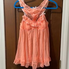 Victoria’s Secret Babydoll Set In Super Soft Sheer Mesh Fabric. Orange With Light Pink Lace Trim. Bow Details And Ruffle Trim. Rhinestone Bow On Top. Babydoll Top With Matching Bikini Bottom. Size Large. Like New, Never Worn Cute Sleeveless Nightgown For Bedtime, Cute Sleeveless Nightgown For Sleepovers, Flirty Victoria's Secret Sleepwear, Flirty Sleeveless Sleepwear With Lace Trim, Spring Sleepover Coquette Sleepwear, Coquette Spring Sleepwear For Sleepover, Coquette Style Sleepwear For Spring Sleepover, Feminine Pink Sheer Sleepwear, Feminine Sheer Pink Sleepwear