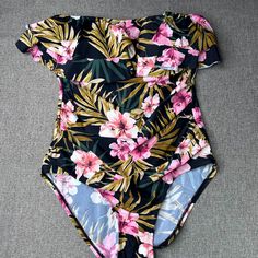 Brand: Kona Sol Size: L (12-14) Materials: Shell (82% Nylon 18% Spandex) - Lining (100% Polyester) Measurements: Please Carefully Review Our Photos To Ensure A Proper Fit Before Purchase. Thank You. Condition: Nwt Color: Black (Floral) Made In Vietnam Fast Shipping! All Items Are Packed And Shipped Within One Business Day. Want To Save? Bundle Your Items Together! Read My Meet The Posher Profile For More Info. Please Check Out Our Closet For More Swimwear! Fitted Tropical Print One-piece Bodysuit, Fitted One-piece Bodysuit With Tropical Print, Fitted One-piece Tropical Print Bodysuit, Black Tropical Stretch Swimwear, Black Stretch Swimwear With Floral Print, Black Printed One-piece Swimsuit For Beach Season, Black Printed One Piece For Beach Season, Black Printed Beachwear One-piece, Printed Black One-piece For Beach Season