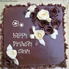 a birthday cake with chocolate frosting and white flowers on the top that says happy birthday casey