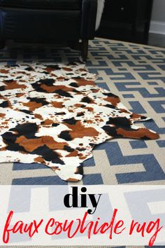 a cow hide rug on the floor in a living room